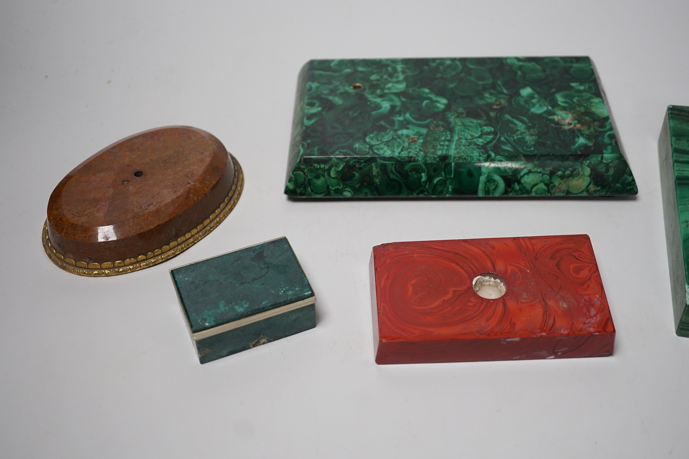 A group of malachite and other hardstone plinths and a small casket